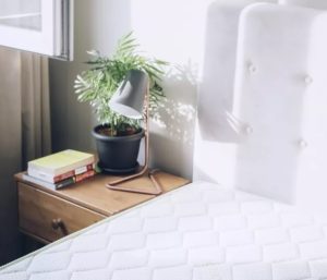 luxury mattress with nightstand and light