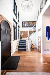 Entryway with Brick and White Walls
