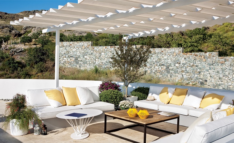 Backyard Patio Area with Outdoor Furniture and Shade Cover