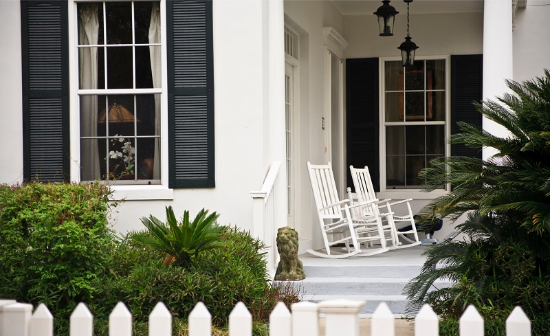 Traditional House with Front Porch and White Picket Fence