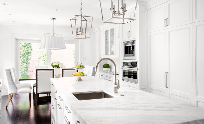 White Luxury Kitchen with White Cabinets and Wood Flooring
