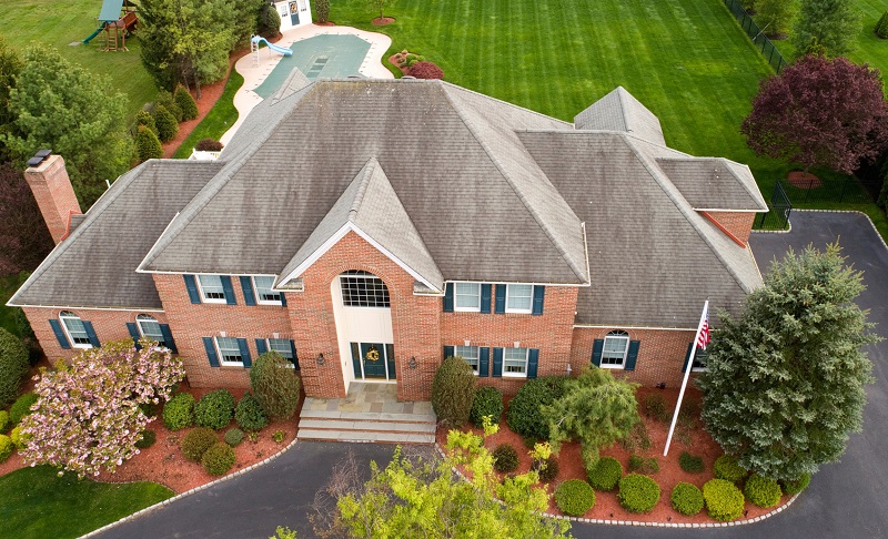 Drone Aerial View of Large Brick Home