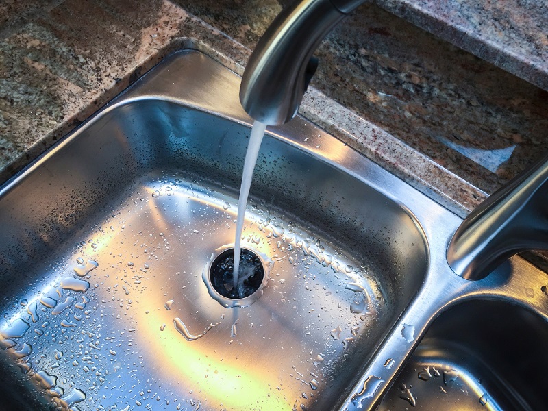 Clean Stainless Steel Kitchen Sink with Running Water