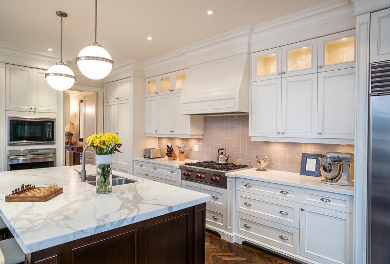 Renovated Luxury Kitchen with White Cabinets and Wood Flooring