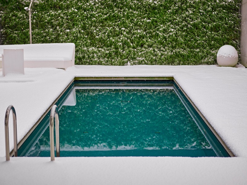 Small Covered Swimming Pool in a Winter Snow Storm