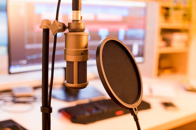 Home Recording Studio Desktop with Microphone and Microphone Screen with ambient lighting