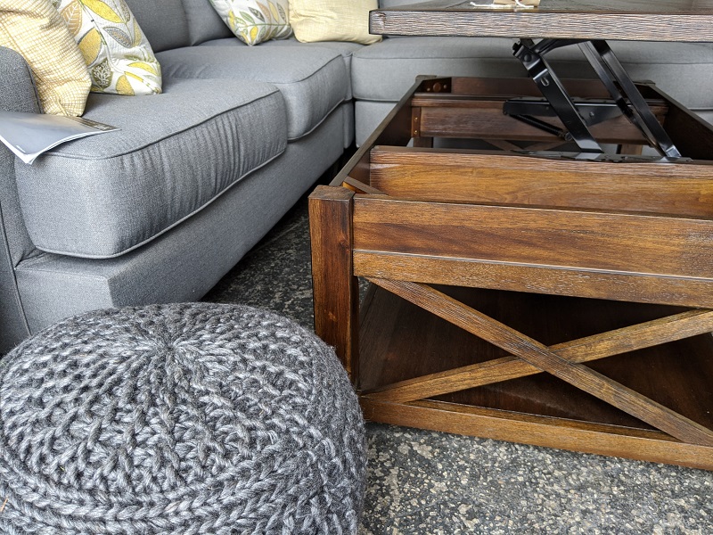 Closeup view of a wooden lift-top coffee table