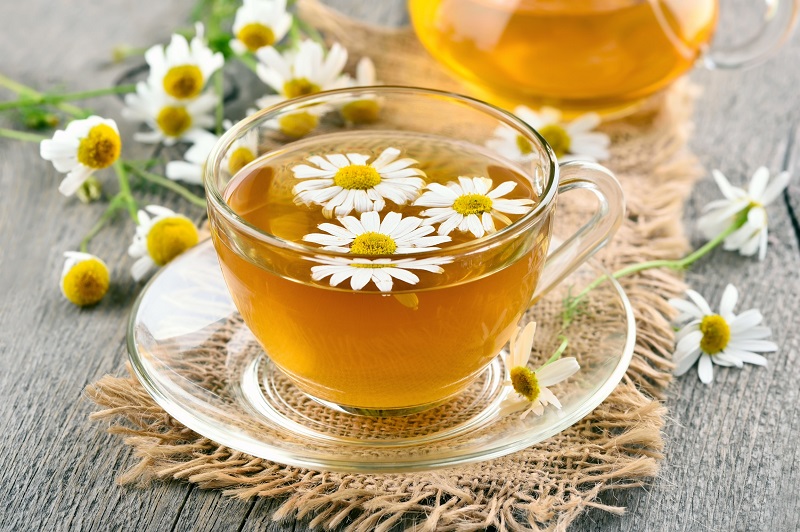 Glass cup of chamomile tea
