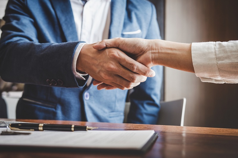 Shaking hand after completing a real estate deal