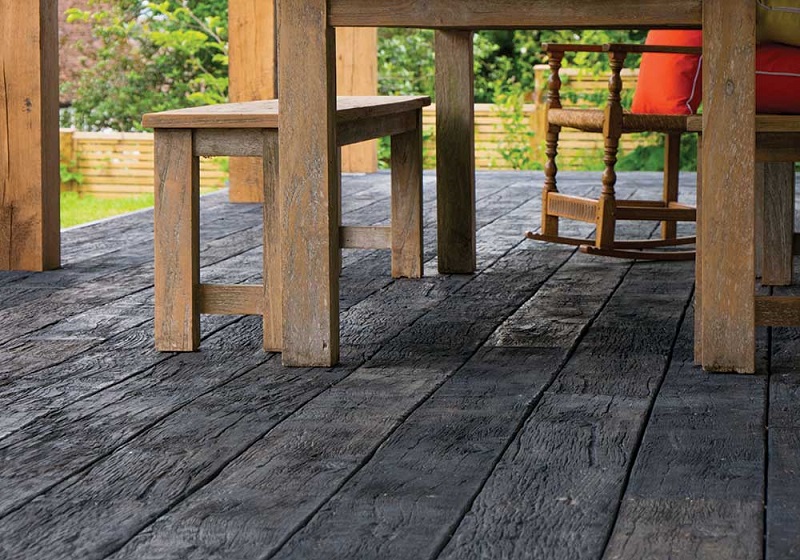 Detailed view of Millboard molded composite deck with outdoor table