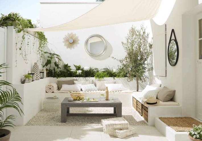 Mediterranean patio with white modern shade sail (formerly Hotel San Giorgio, Mykonos, Greece)