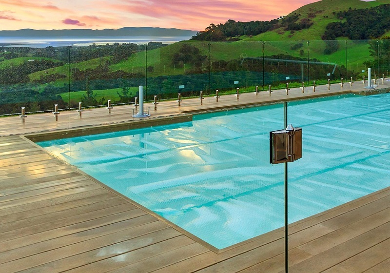 Millboard molded composite pool deck with view