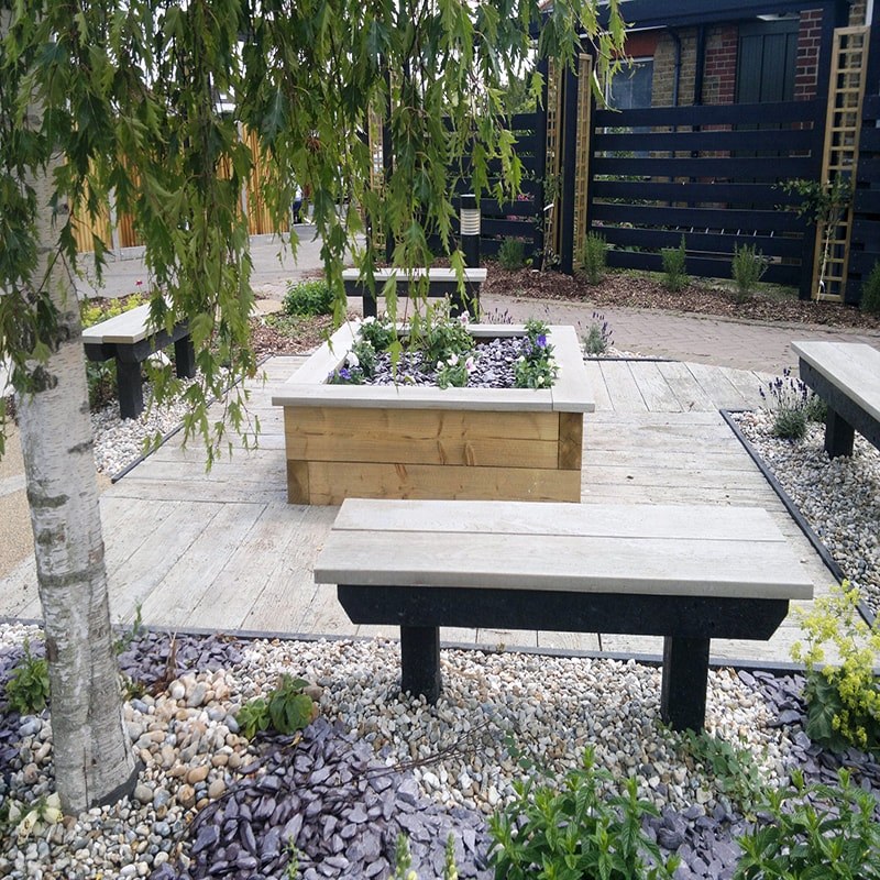 Millboard outdoor benches and planter at Whitstable Tankerton Hospital Weathered Oak Driftwood