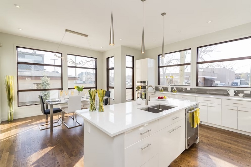 Sunny white remodeled kitchen with several new windows