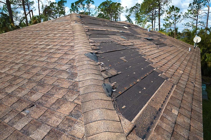 Damaged roof of home after hurricane winds