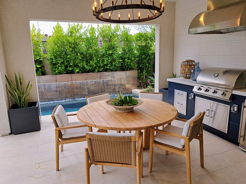 New California model home with blue modular outdoor kitchen kit and outdoor living space