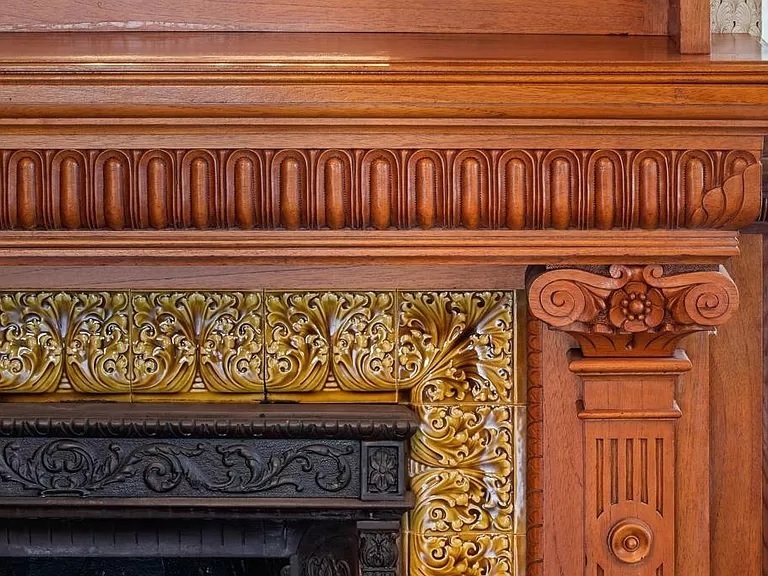 Close up view of a fireplace mantel in the historic Long-Waterman House, Victorian Mansion in San Diego, California