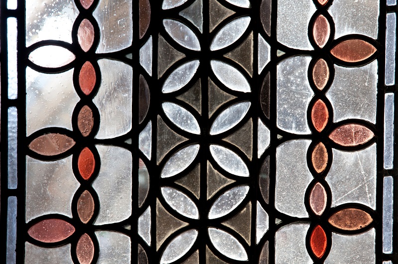 Stained glass window of a Victorian home