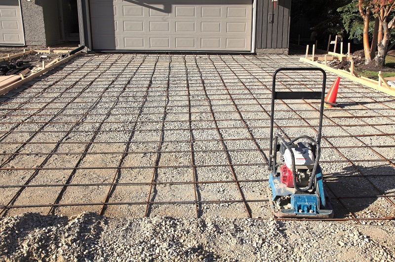Home driveway being prepped with rebar for concrete pour