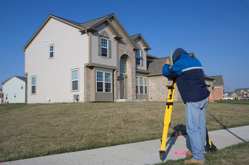 Land surveyor in residential community