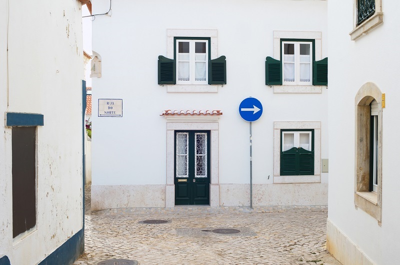 Narrow intersection in small sunny Portugal town