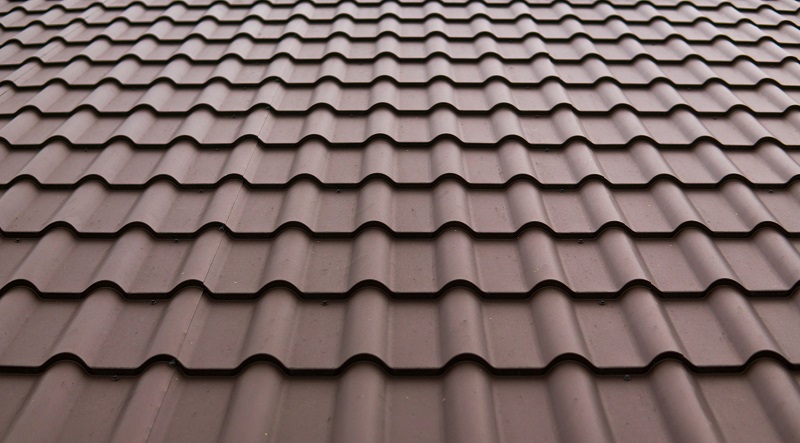 Close up view of brown stone coated steel roofing