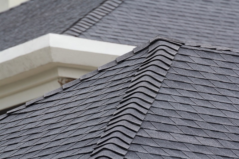 Close up view of newly installed asphalt shingles on home