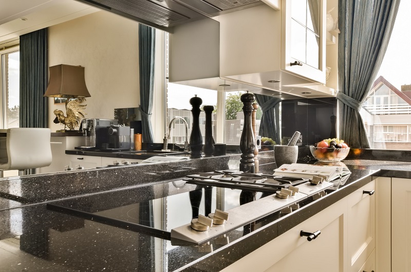 Modern upgraded kitchen with restored granite countertops