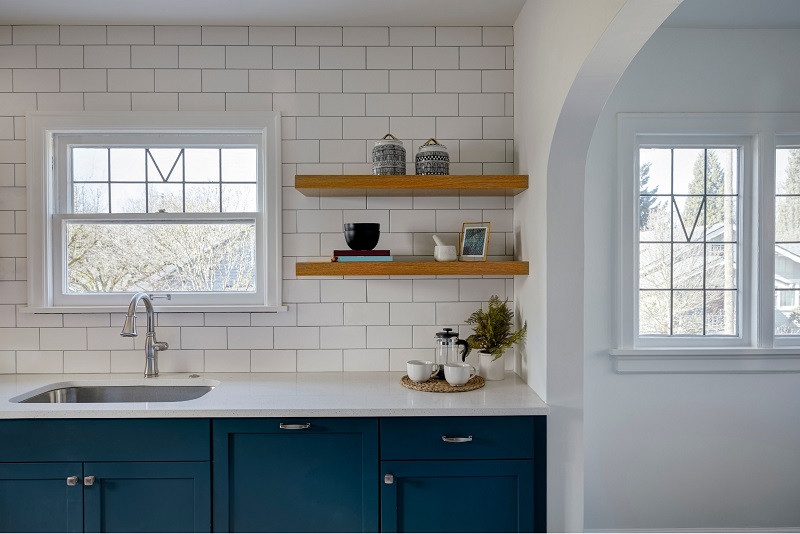 Upgraded farmhouse kitchen with white subway tile backsplash