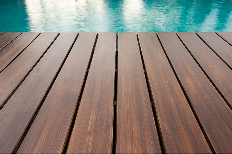 Pristine swimming pool with beautiful wooden decking
