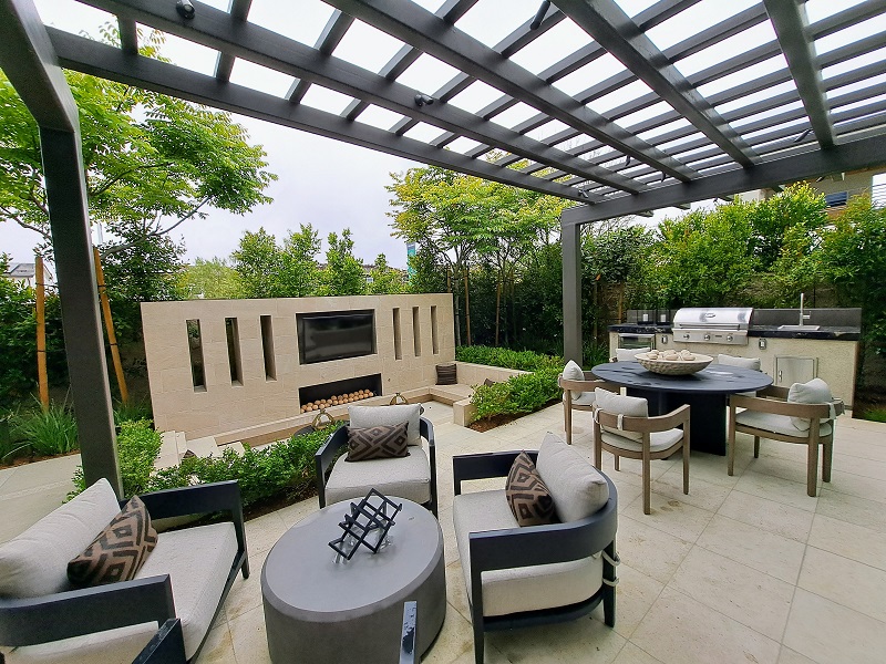 Luxury patio area with outdoor kitchen and fireplace