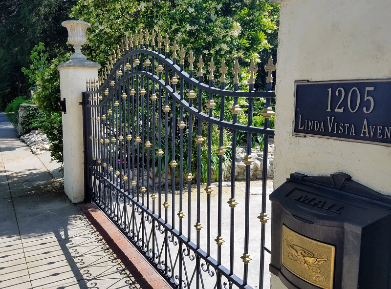 Detailed iron gate to long driveway