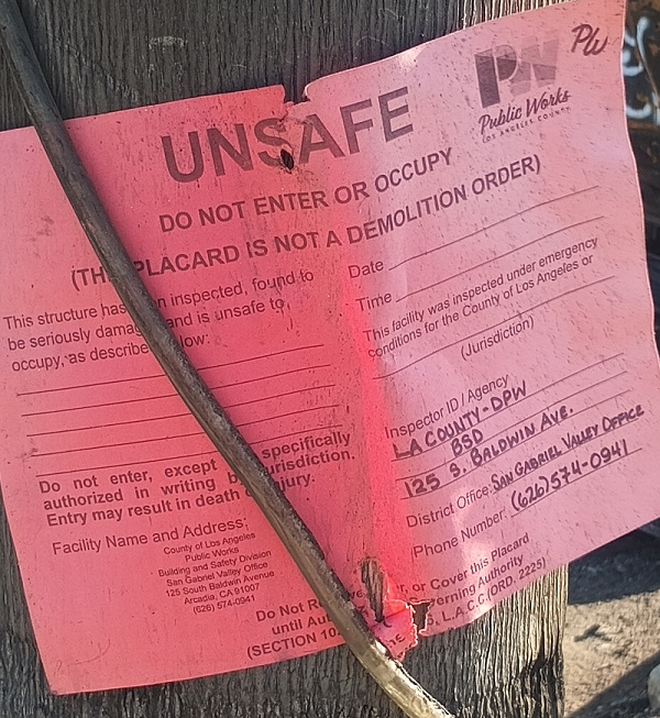 Altadena Eaton Fire red unsafe sign posted by LA Public Works