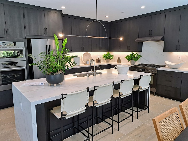 Luxury kitchen with dark gray laminate cabinetry