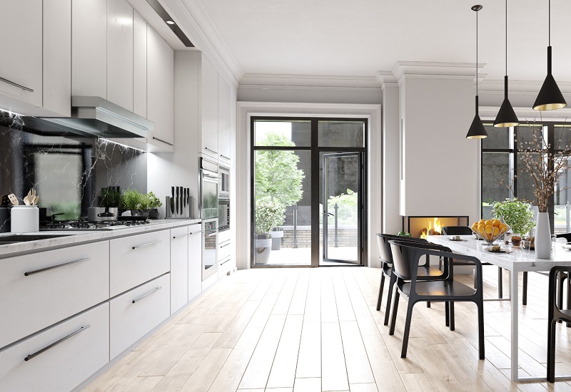Stylish white and black open kitchen with laminate cabinetry