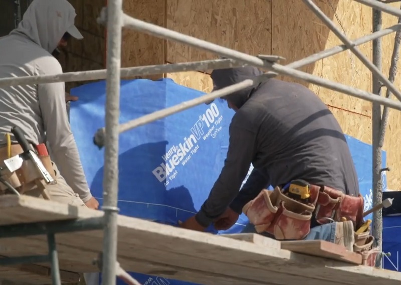 TNAH 2025 Henry Blue VP100 self-adhered housewrap being applied
