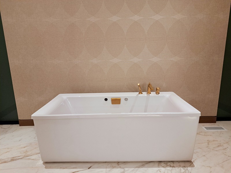 TNAH 2025 Master suite bathroom with textured wallpaper framing the bathtub