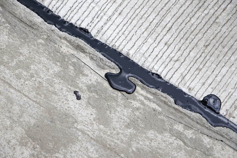 Asphalt driveway crack filler