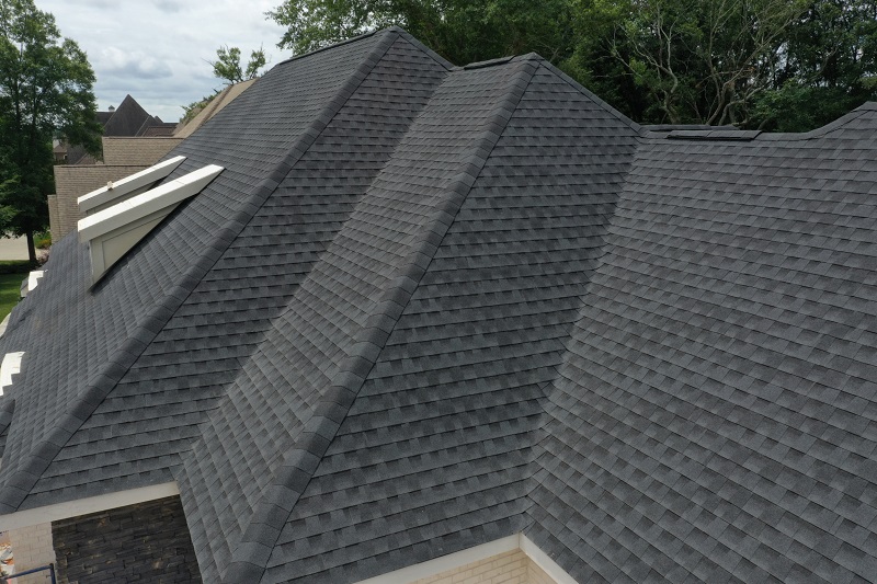 Dark asphalt shingles on new home construction