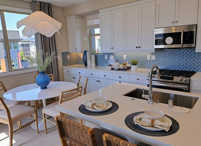 Kitchen dining area with attractive white light fixture over blue vase