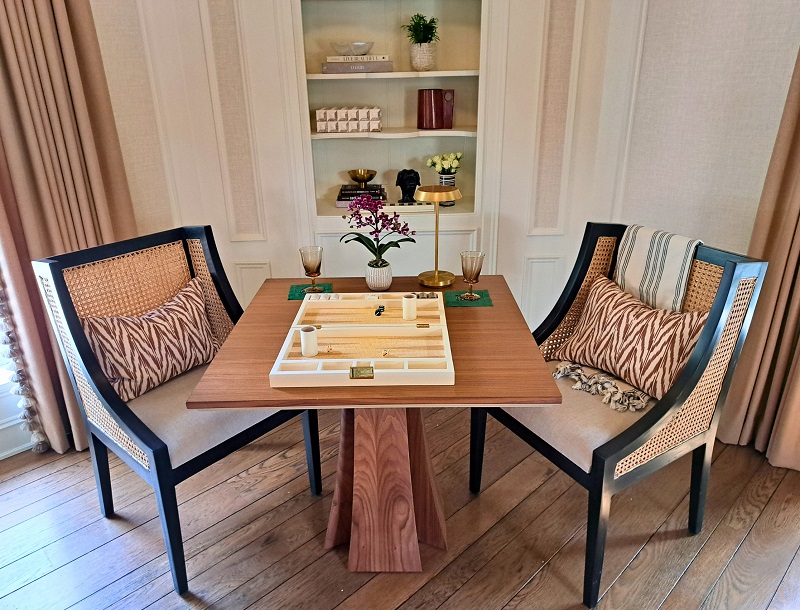 PSH 2025 Bauer Lounge designed by Denise Bosley: backgammon game table with console chairs