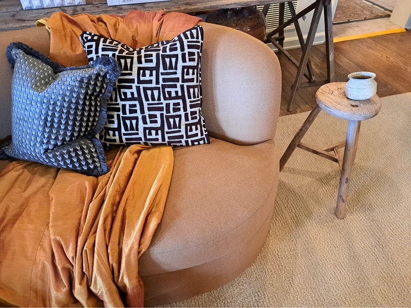 PSH 2025 Primary Suite designed by Alexandra Azat: Close of view of the custom sofa