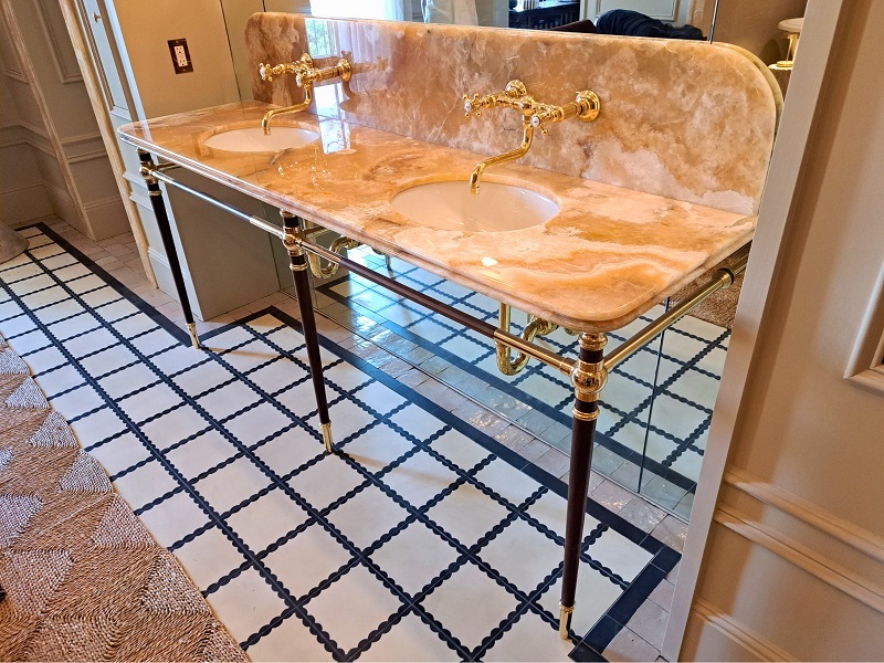 PSH 2025 Primary Suite bathroom designed by Alexandra Azat: Golden Onyx countertop on a double console sink