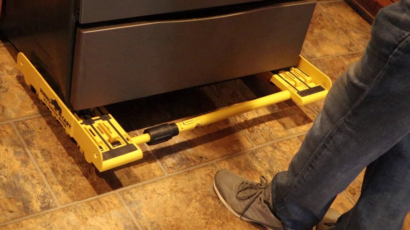 A Rhino Cart lifting and moving a bulky piece of furniture