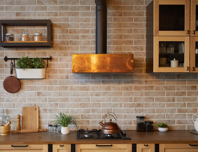 Small kitchen with interesting copper stove hood