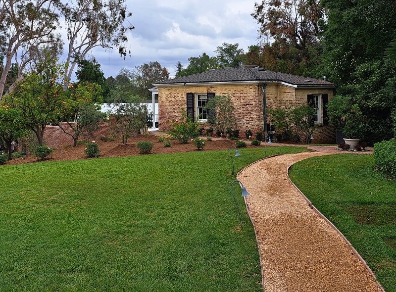 Winding gravel pathway to carriage guest house of the 2025 Pasadena Showcase House