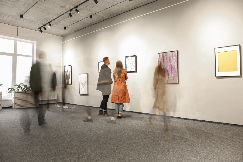 art patrons exploring works of art