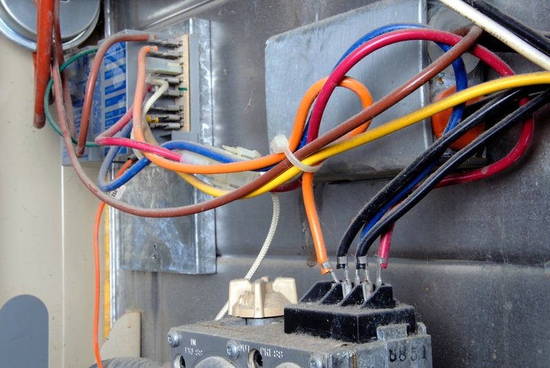 Colorful wiring used in the circuitry of a 20-year old home furnace