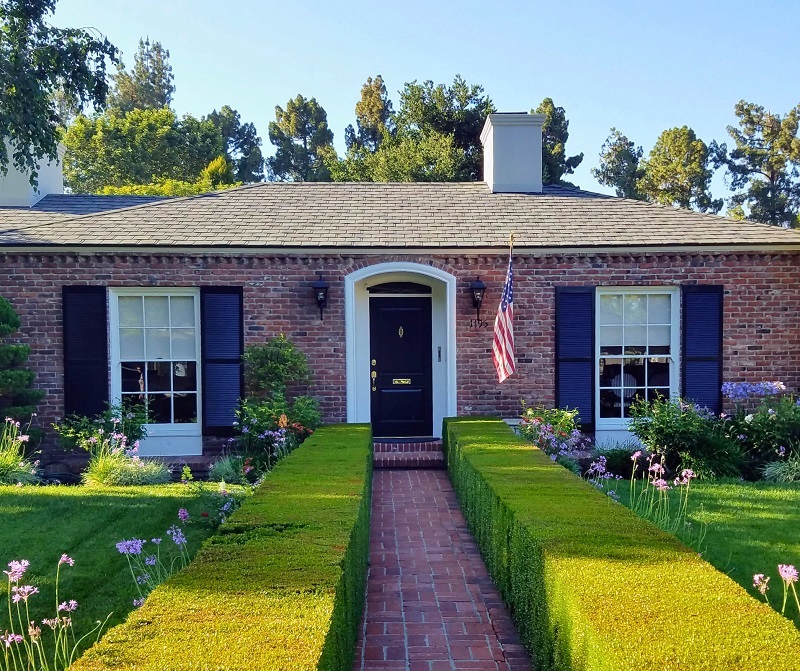 Brick home with landscaped curb appeal