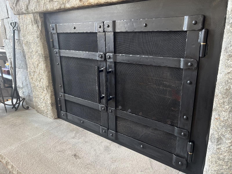 Custom metal fireplace screen and door by Creative Metal Design